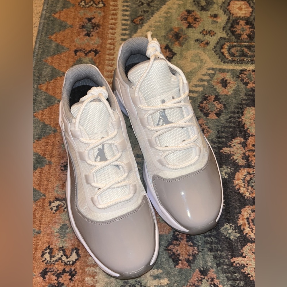 Air Jordan 11s low rise. Brand new/never worn. They just dont fit.
